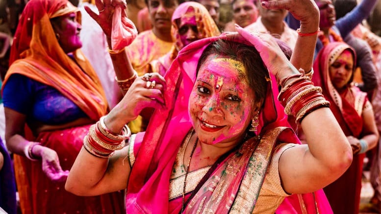 Indian woman celebrating holi festival