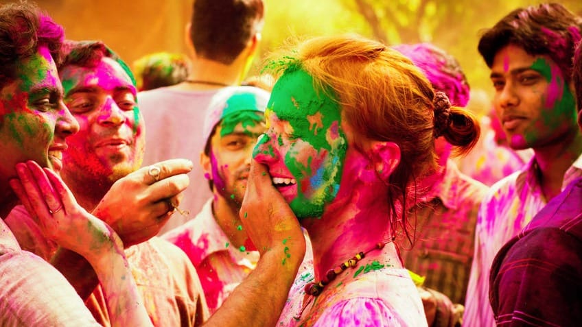 Celebration of the festival of colors in India Couple celebrating love and the holi festival